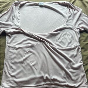 Baby pink long sleeve top with twist front design from Aritzia never worn. 🎀